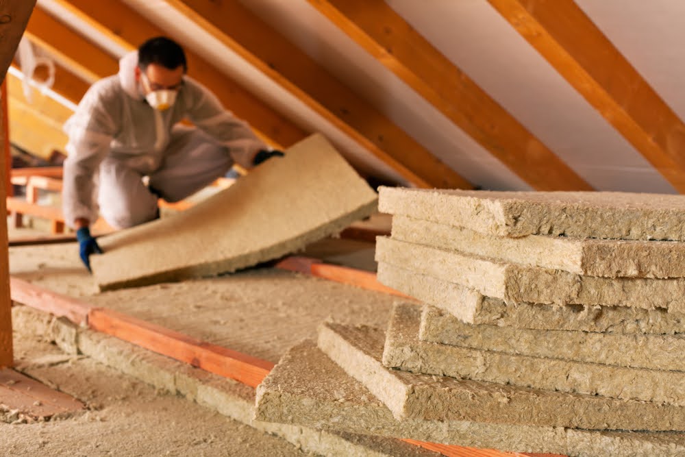 Blown-in insulation next to batt insulation