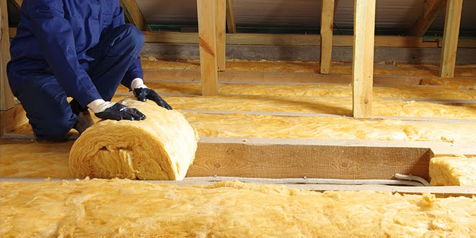 Attic insulation replacement contractor at work