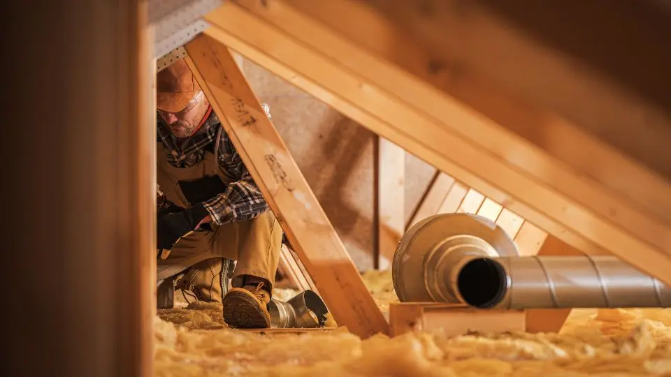 Dallas attic insulation company technician installing insulation