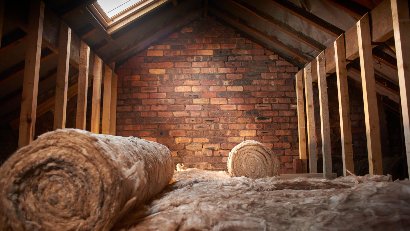 Attic insulation installation in a Dallas home