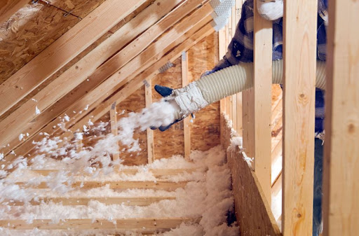 Layers of attic insulation showing different insulation types