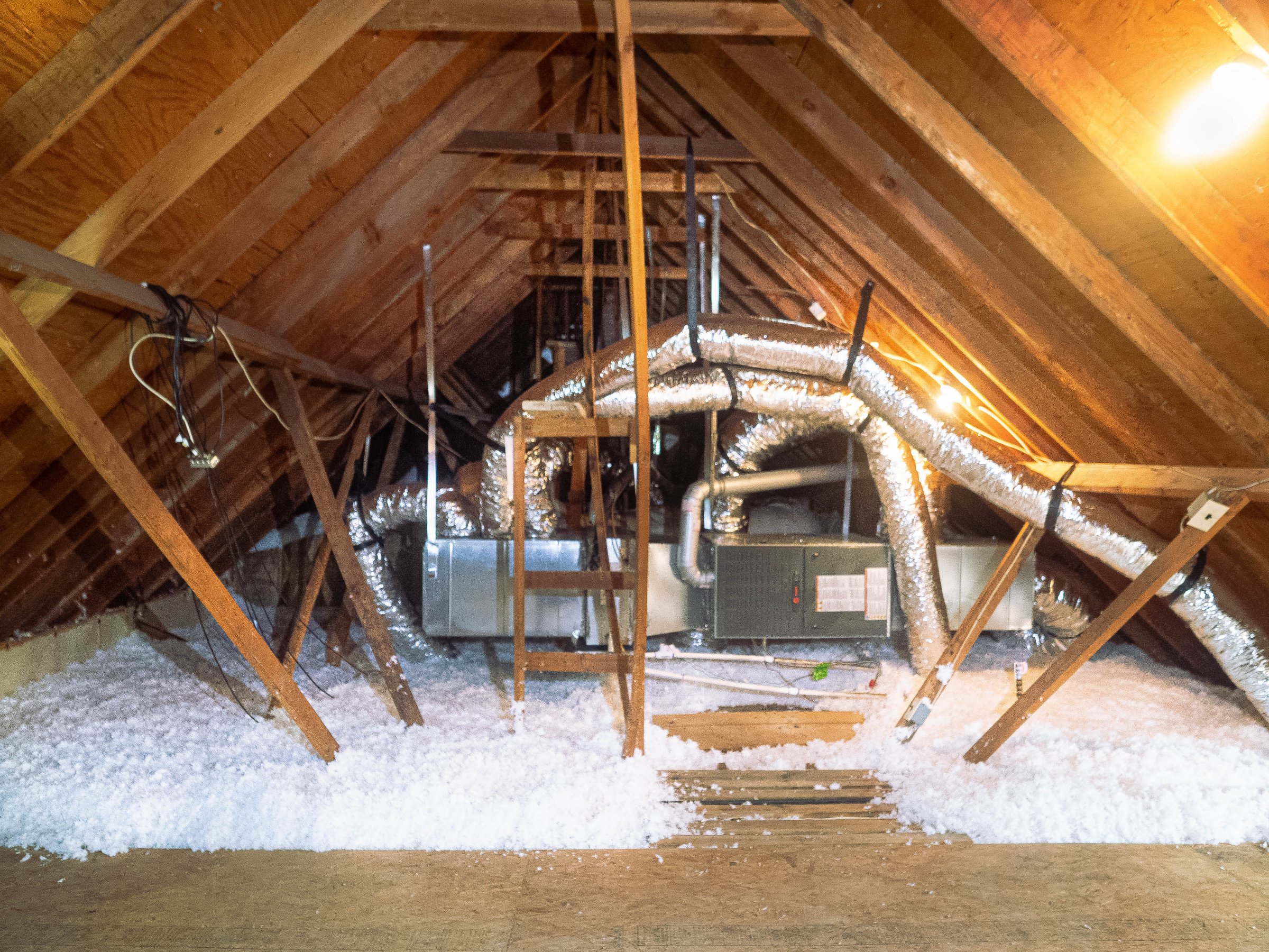 Attic with fresh blown-in insulation after the old insulation was removed and replaced